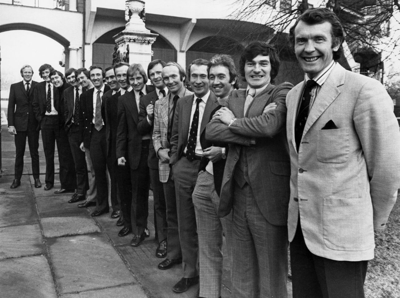 The England players pose for a photo outside Lord's. From left: Tony Greig, Bob Willis, Mike Hendrick, Chris Old, Pat Pocock, Geoff Arnold, John Jameson, Derek Underwood, Frank Hayes, Dennis Amiss, Jack Birkenshaw, Keith Fletcher, Bob Taylor, Alan Knott and Mike Denness, December 31, 1973
