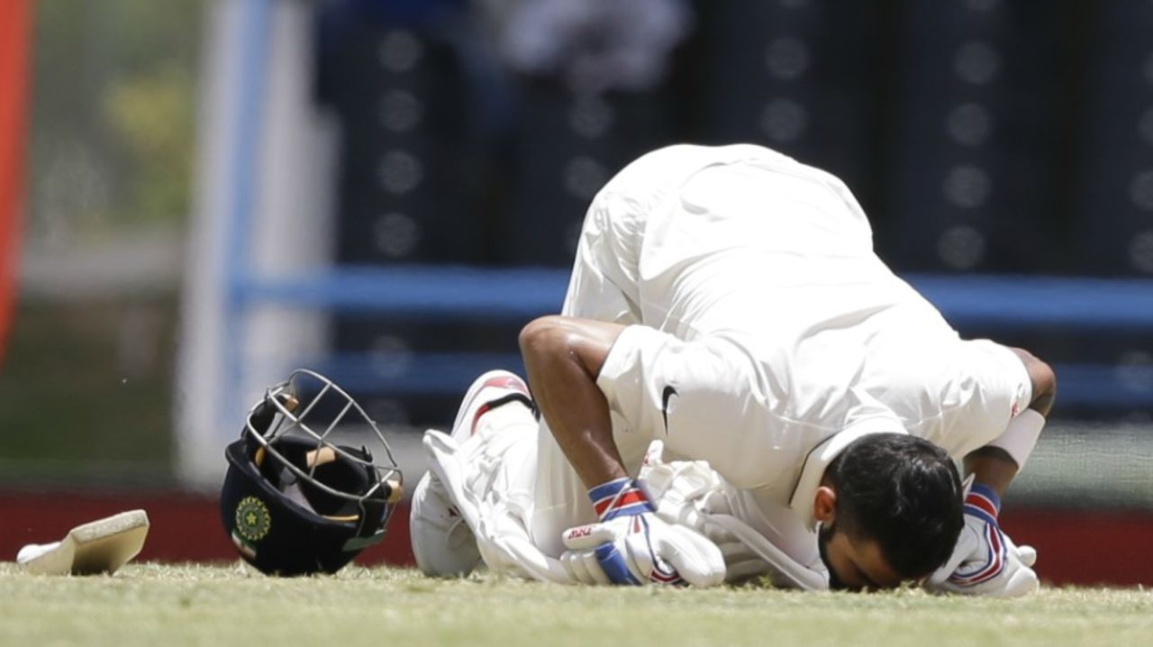 Virat Kohli kisses the pitch after reaching his double hundred, West Indies v India, 1st Test, Antigua, 2nd day, July 22, 2016