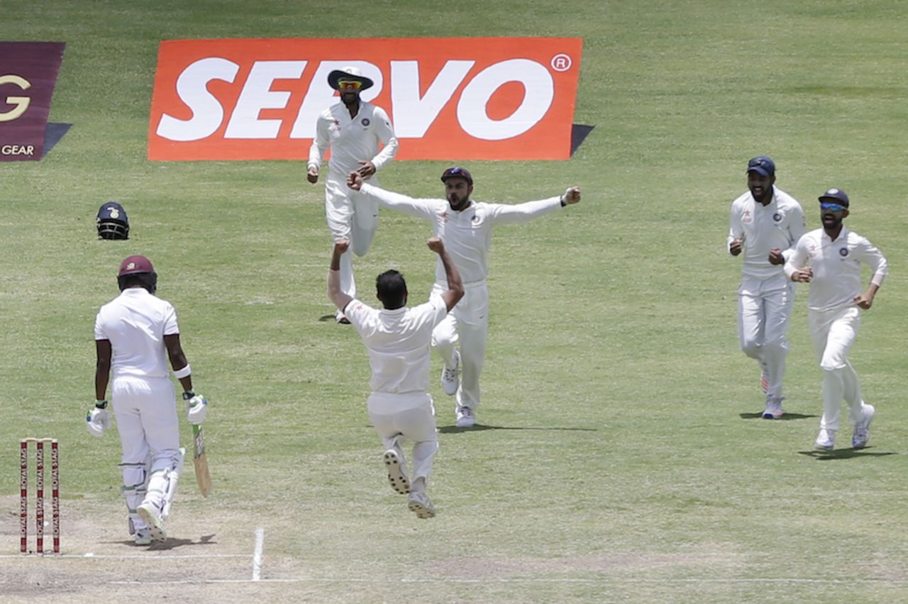 The Indian players celebrate after Mohammed Shami dismisses Darren Bravo, West Indies v India, 1st Test, Antigua, 3rd day, July 23, 2016