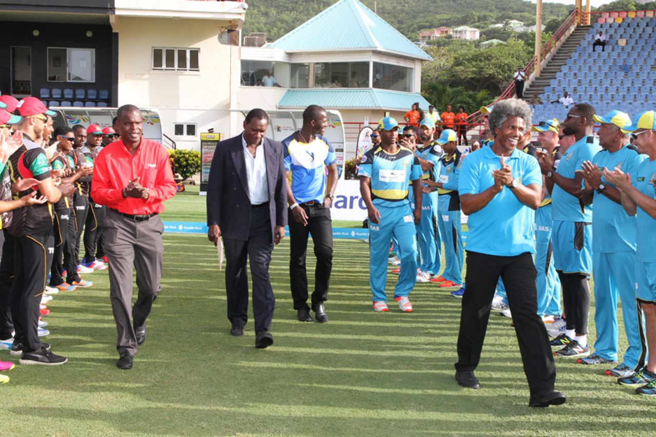 Darren Sammy and Johnson Charles walk through a guard of honour at a ceremony in which the Beausejour Stadium was renamed after Darren Sammy and a stand in it after Johnson Charles, St Lucia, July 21, 2016