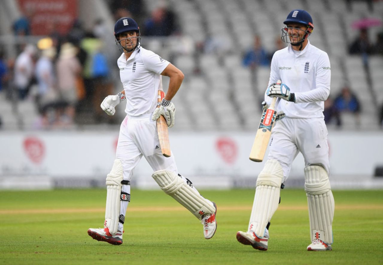 Alex Hales and Alastair Cook run from the field during a rain break, England v Pakistan, 2nd Investec Test, Old Trafford, 3rd day, July 24, 2016