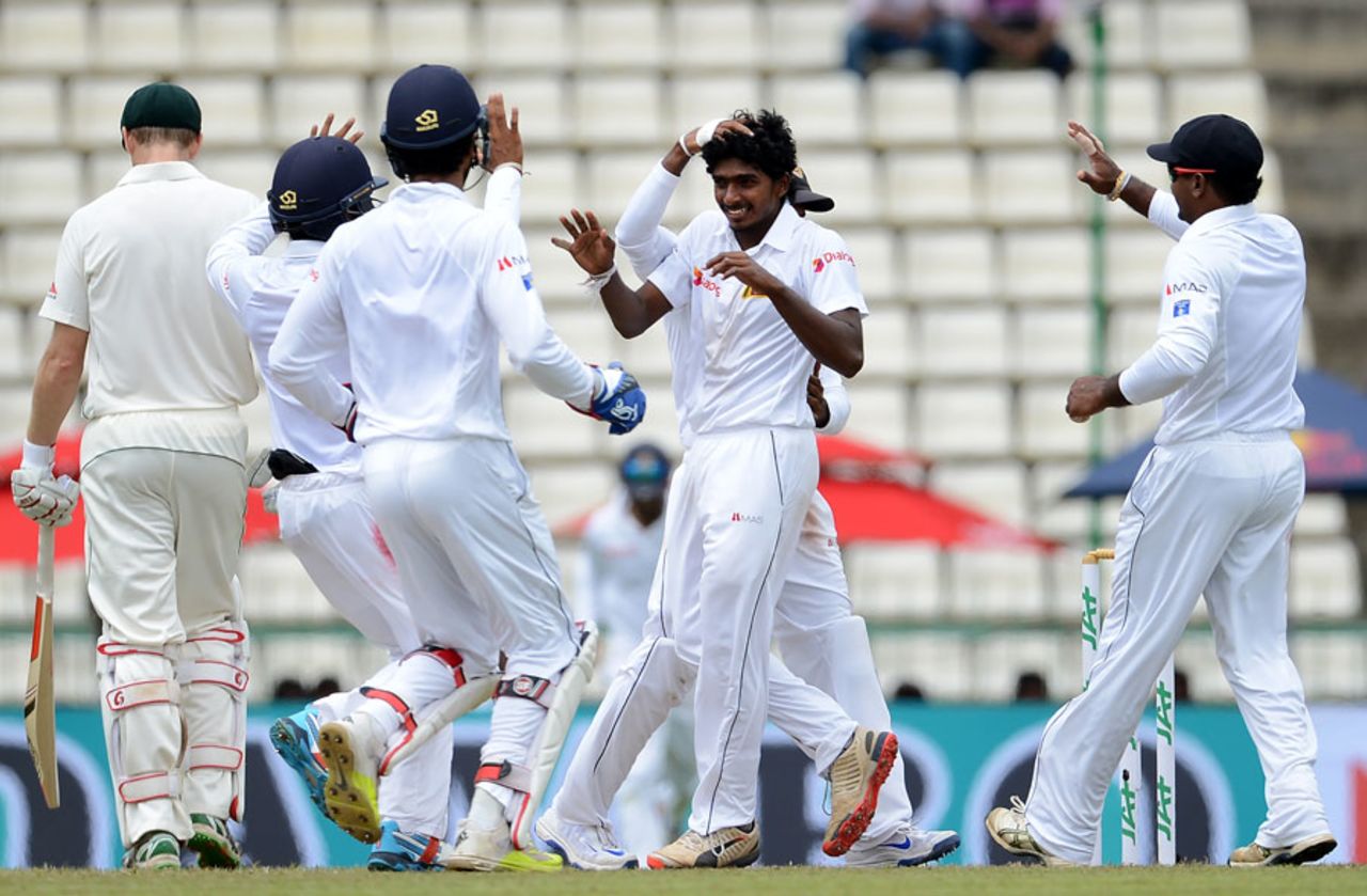 Debutant Lakshan Sandakan celebrates his maiden Test wicket, having bowled Mitchell Marsh, Sri Lanka v Australia, 1st Test, Pallekele, 2nd day, July 27, 2016