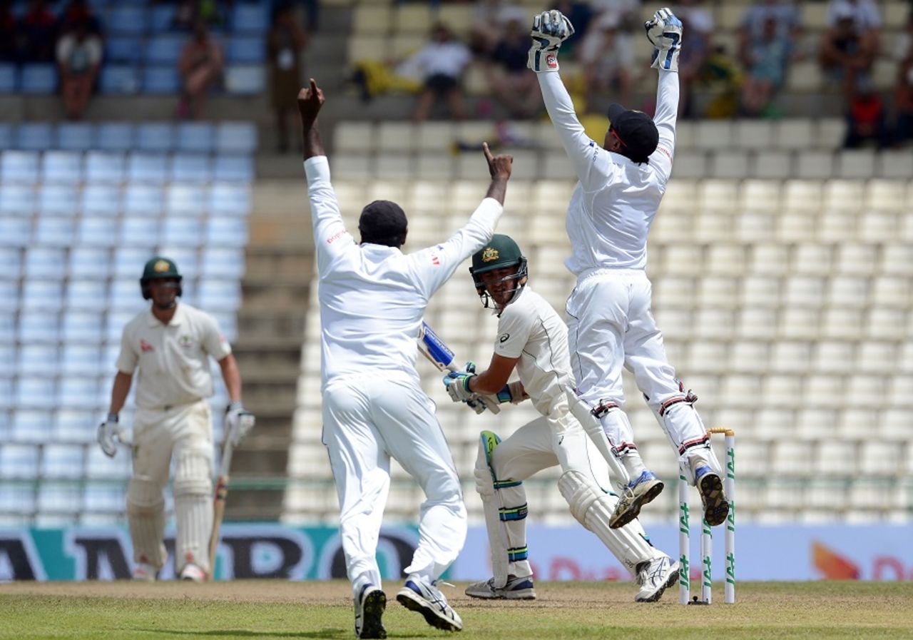 Sri Lanka players celebrate after dismissing Mitchell Starc, Sri Lanka v Australia, 1st Test, Pallekele, 2nd day, July 27, 2016