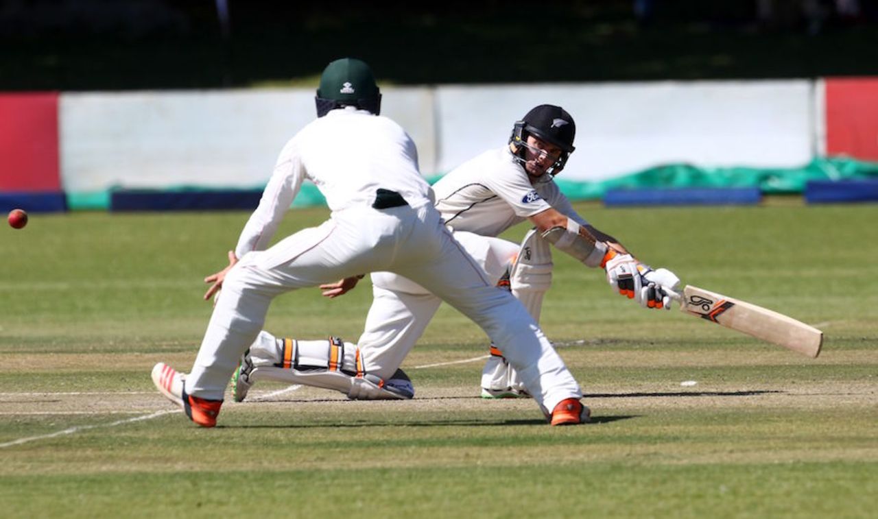 Tom Latham sweeps during his solid innings, Zimbabwe v New Zealand, 1st Test, Bulawayo, 2nd day, July 29, 2016