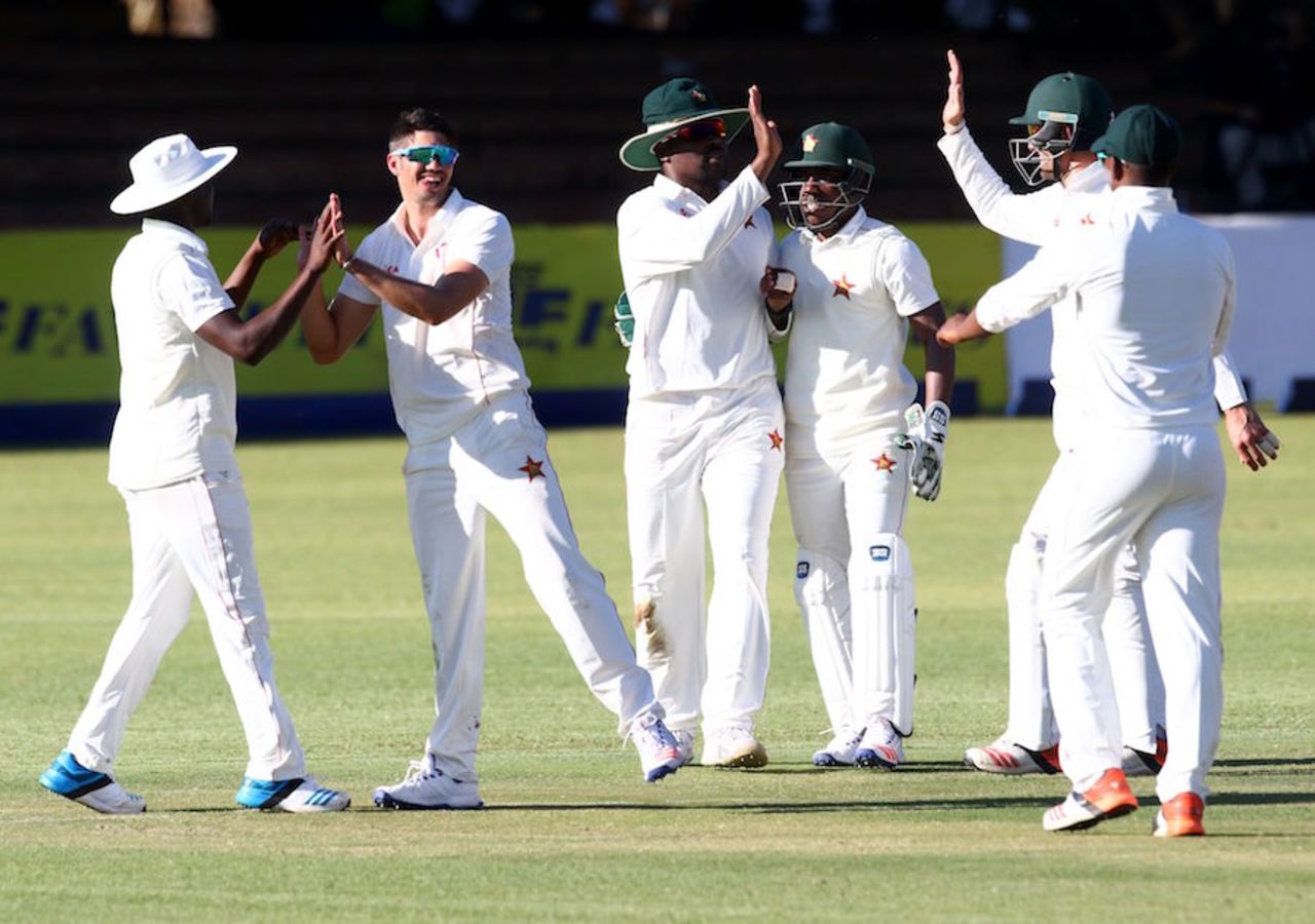 The Zimbabwe players get together to celebrate a wicket, Zimbabwe v New Zealand, 1st Test, Bulawayo, 2nd day, July 29, 2016