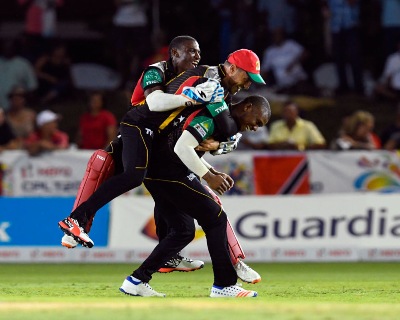 Evin Lewis is mobbed by his team-mates after running out Hashim Amla, St Kitts & Nevis Patriots v Trinbago Knight Riders, CPL 2016, Lauderhill, July 29, 2016
