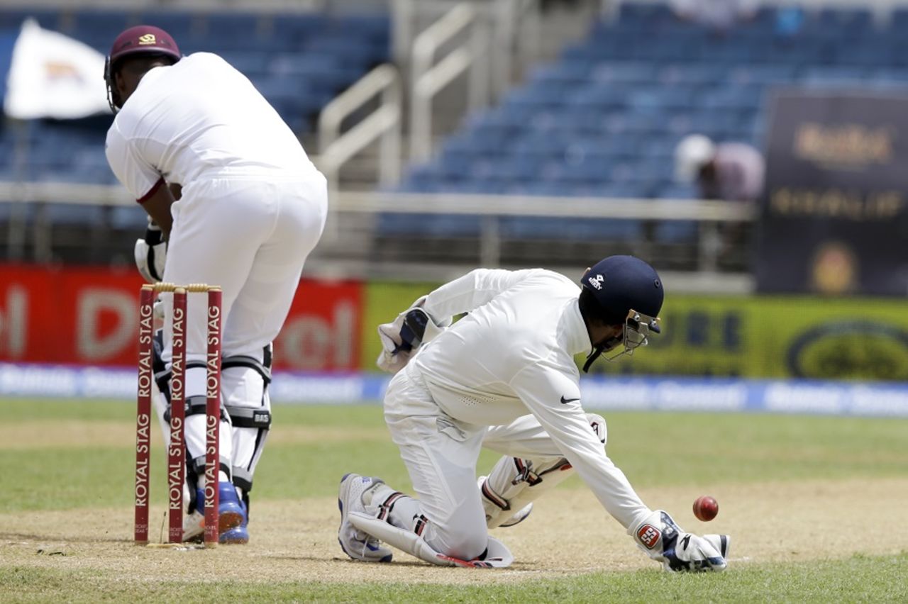 Miguel Cummins is put down by Wriddhiman Saha, West Indies v India, 2nd Test, Kingston, 1st day, July 30, 2016
