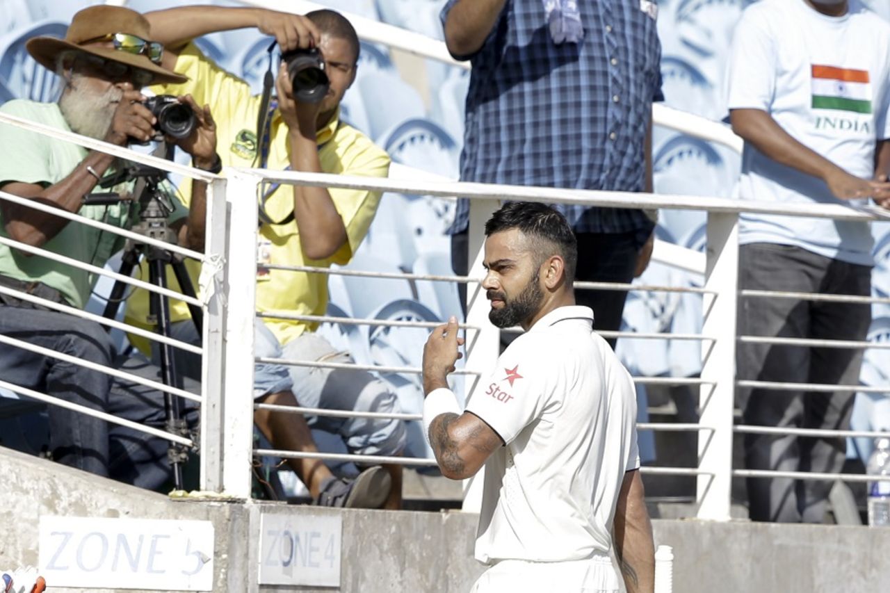 Smile, please? Fans snap a picture of Virat Kohli as he walks back to the pavilion, West Indies v India, 2nd Test, Kingston, 2nd day, July 31, 2016