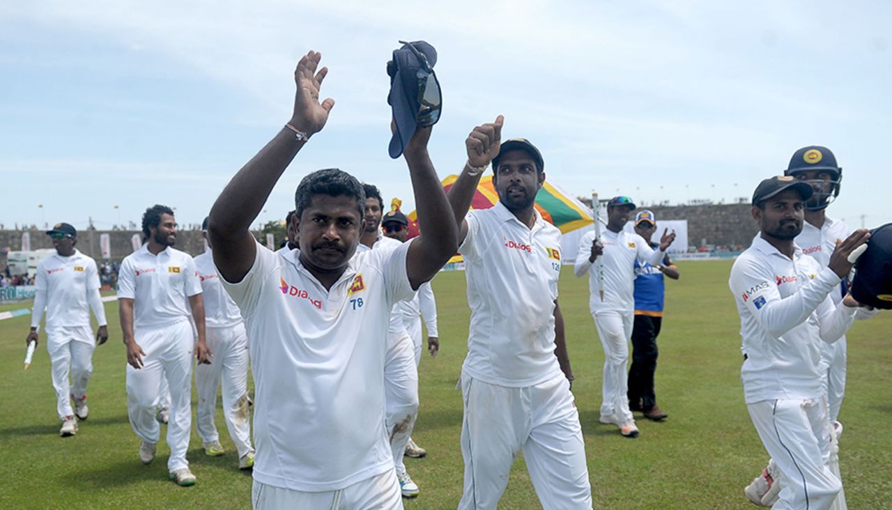 Rangana Herath and Dilruwan Perera acknowledge fans at the ground after the win, Sri Lanka v Australia, 2nd Test, Galle, 3rd day, August 6, 2016