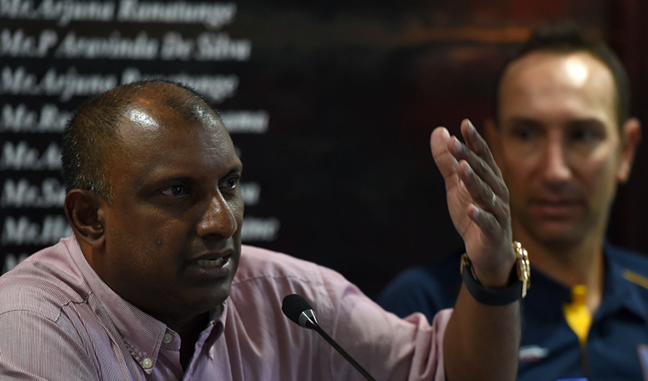 Aravinda de Silva speaks at a press meeting while Nic Pothas looks on, Colombo, August 10, 2016