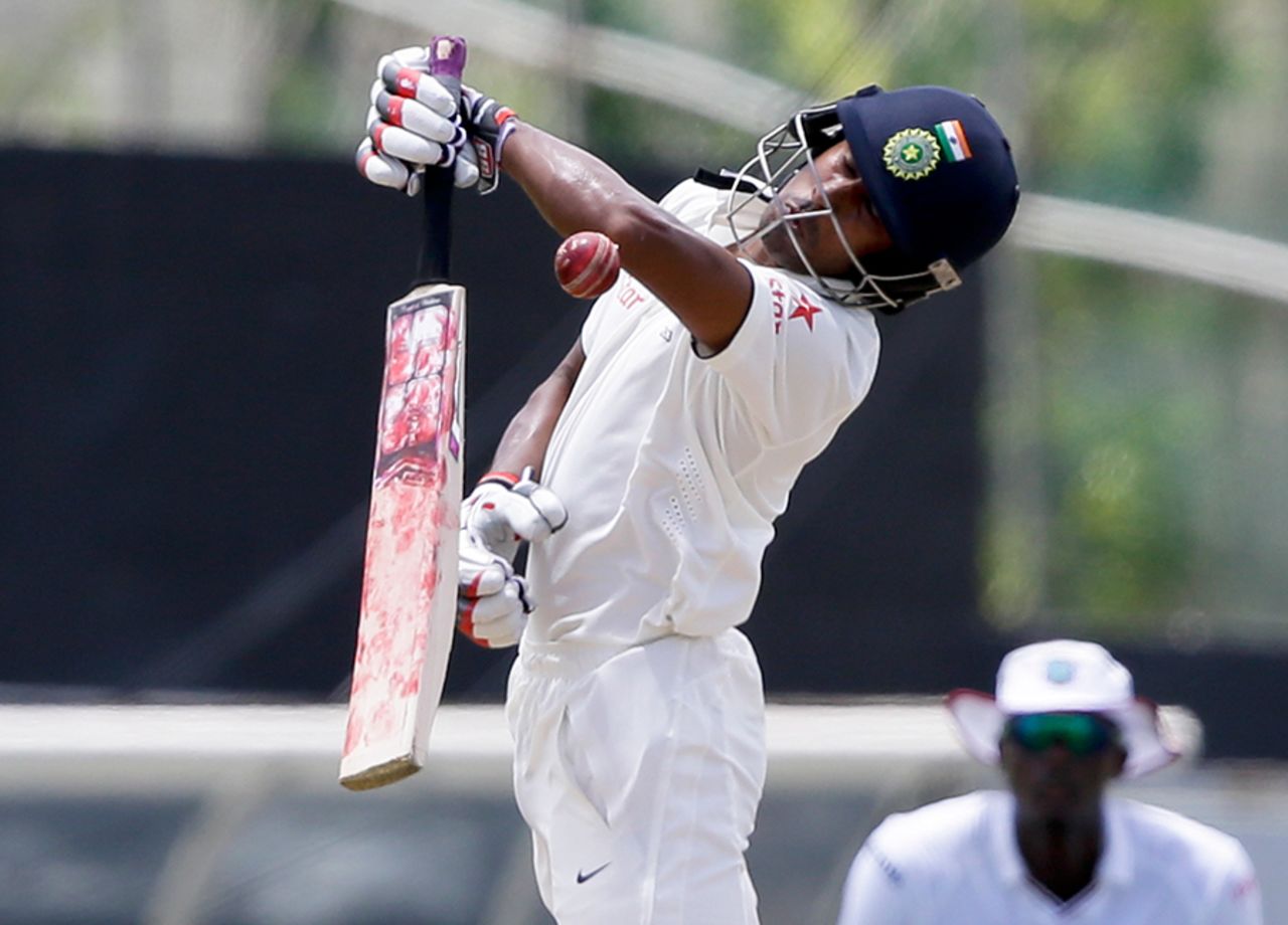 Wriddhiman Saha tries to fend off a short ball, West Indies v India, 3rd Test, Gros Islet, 2nd day, August 10, 2016