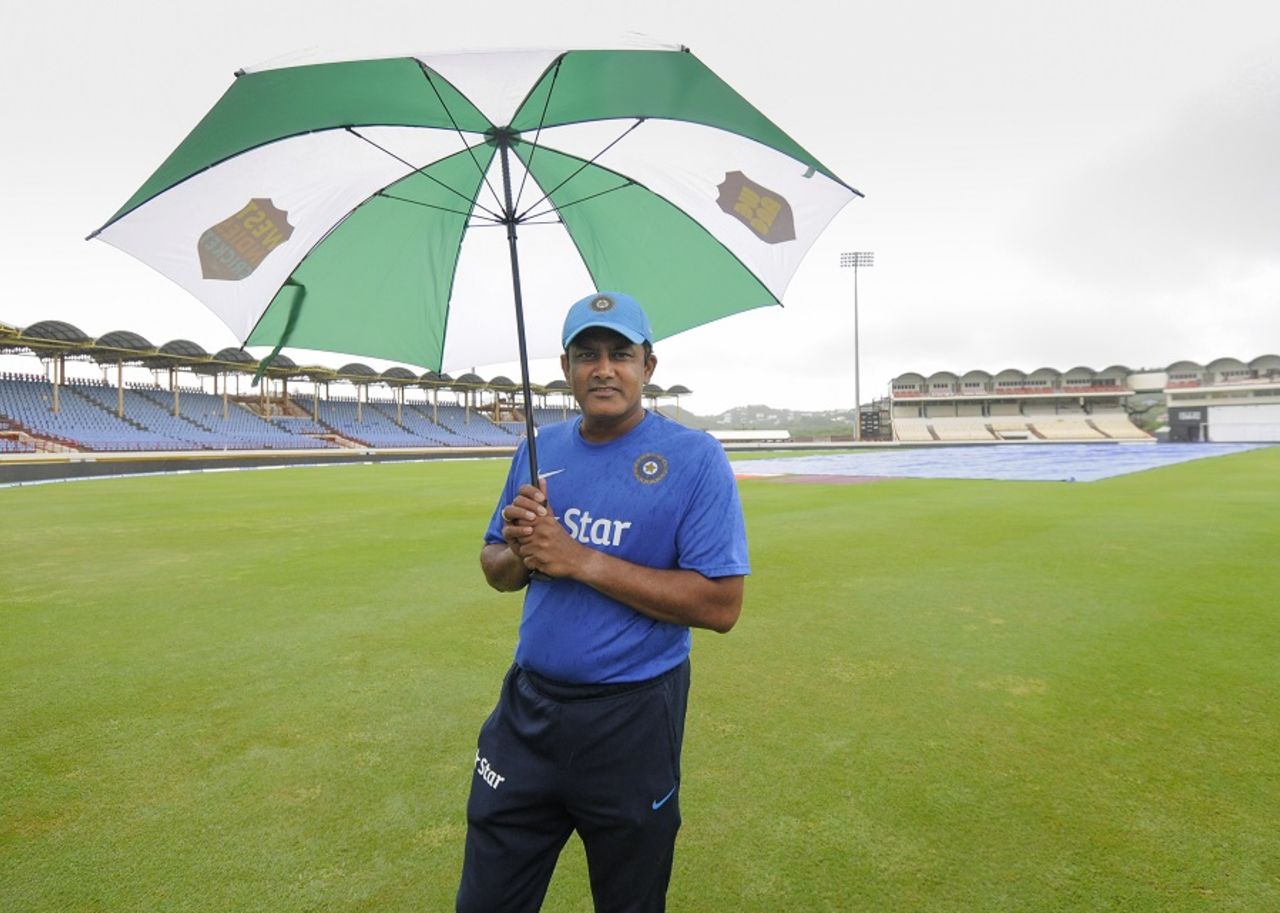 Anil Kumble takes shelter under an umbrella, West Indies v India, 3rd Test, Gros Islet, 3rd day, August 11, 2016