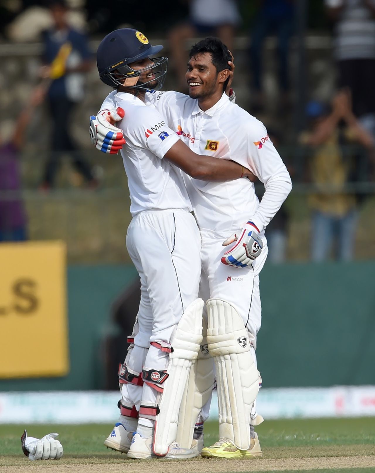 Dhananjaya de Silva is pulled into an embrace by Dinesh Chandimal after raising his maiden Test century, Sri Lanka v Australia, 3rd Test, SSC, 1st day, August 13, 2016