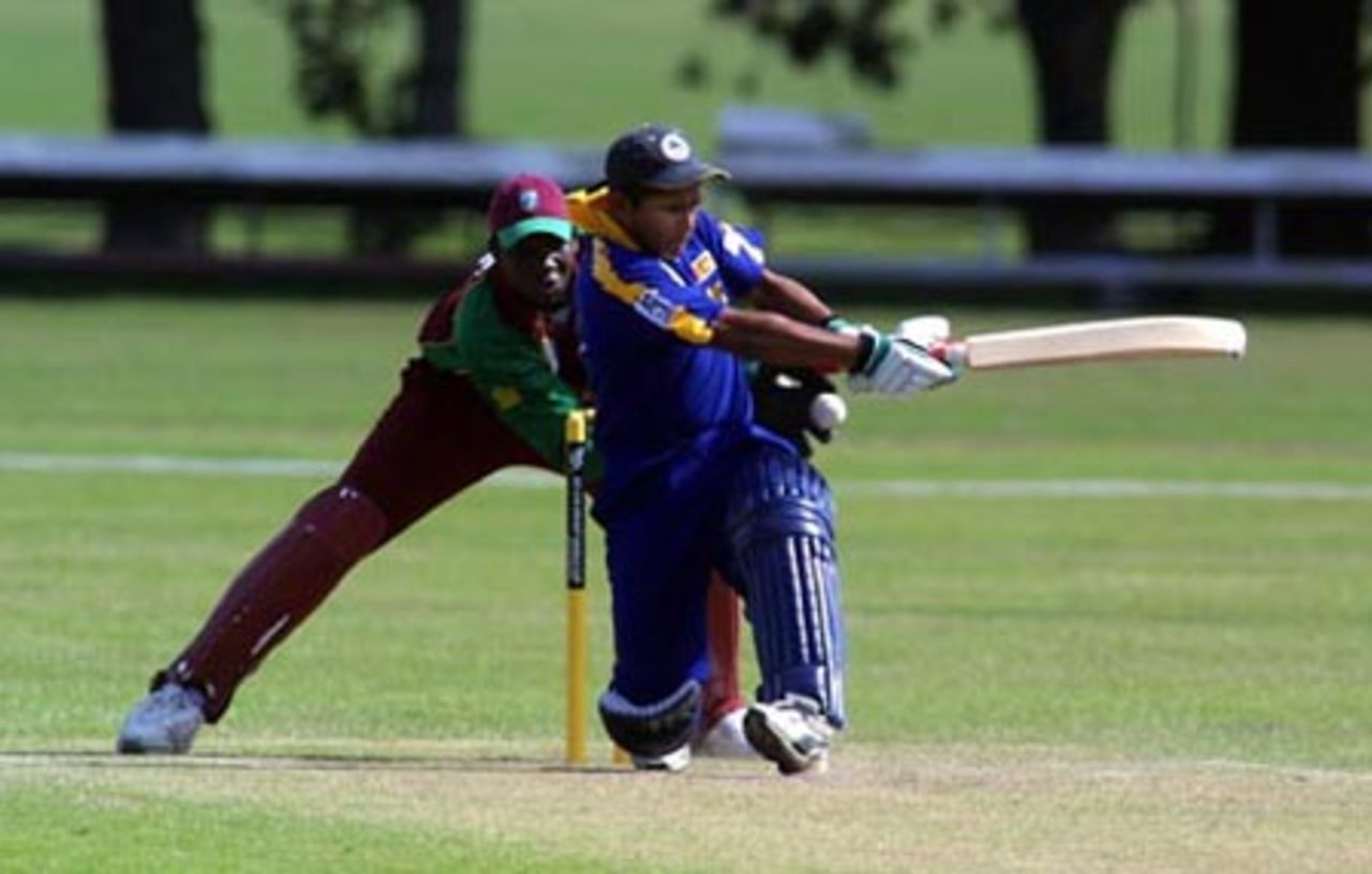 Sri Lanka Under-19 batsman Prasad Ranawaka misses an attempted sweep during his innings of 28. Wicket-keeper Gareth Matthew looks on. ICC Under-19 World Cup Super League Group 1: Sri Lanka Under-19s v West Indies Under-19s at Hagley Oval, Christchurch, 31 January 2002.