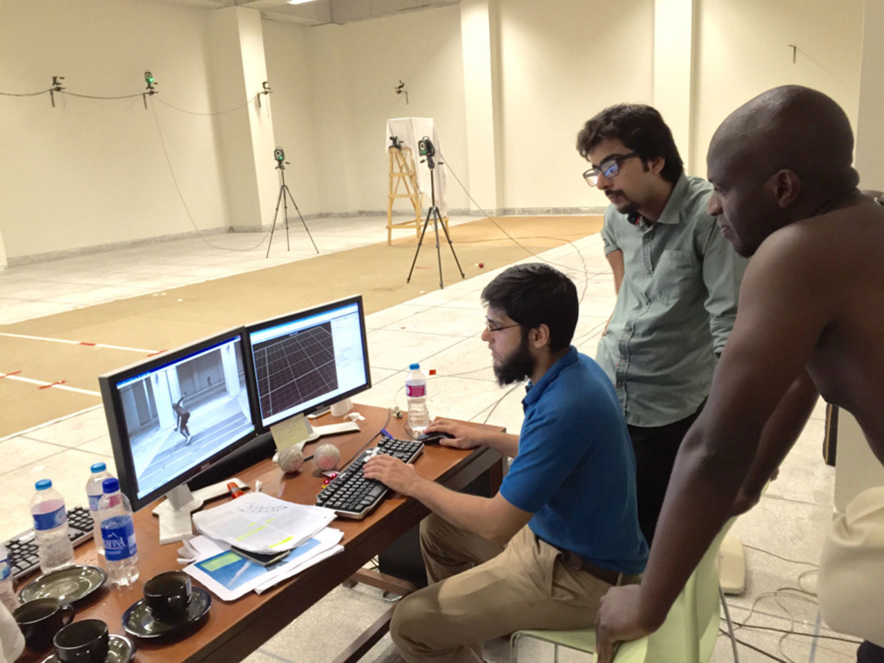 James Ngoche examines footage of his action at the NCA's biomechanics facility, Lahore, August 16, 2016