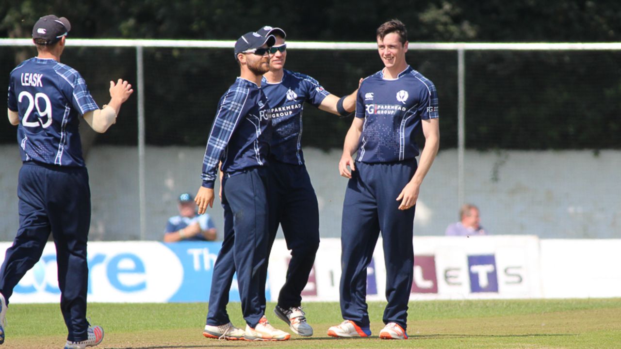 Chris Sole gets congratulated after his third wicket on debut, Scotland v UAE, ICC WCL Championship, Edinburgh, August 16, 2016
