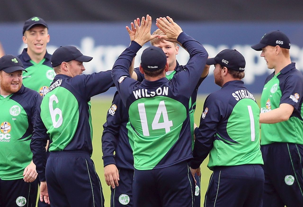 Barry McCarthy celebrates with team-mates after picking up one of his four wickets, Ireland v Pakistan, 1st ODI, Malahide, August 18, 2016