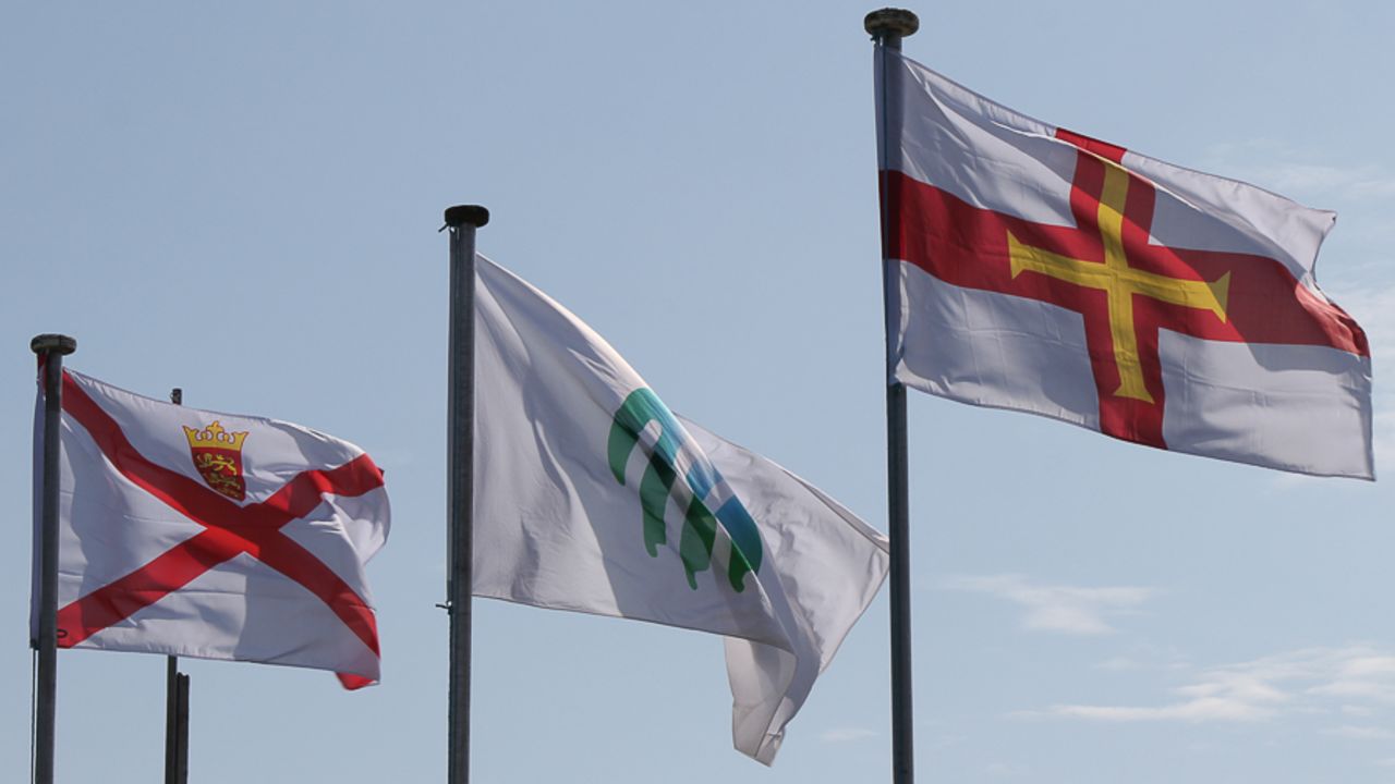Jersey (left) and Guernsey (right) flags fly high at the start of play, Jersey v Guernsey, ICC World Cricket League Division Five, St Martin, May 25, 2016
