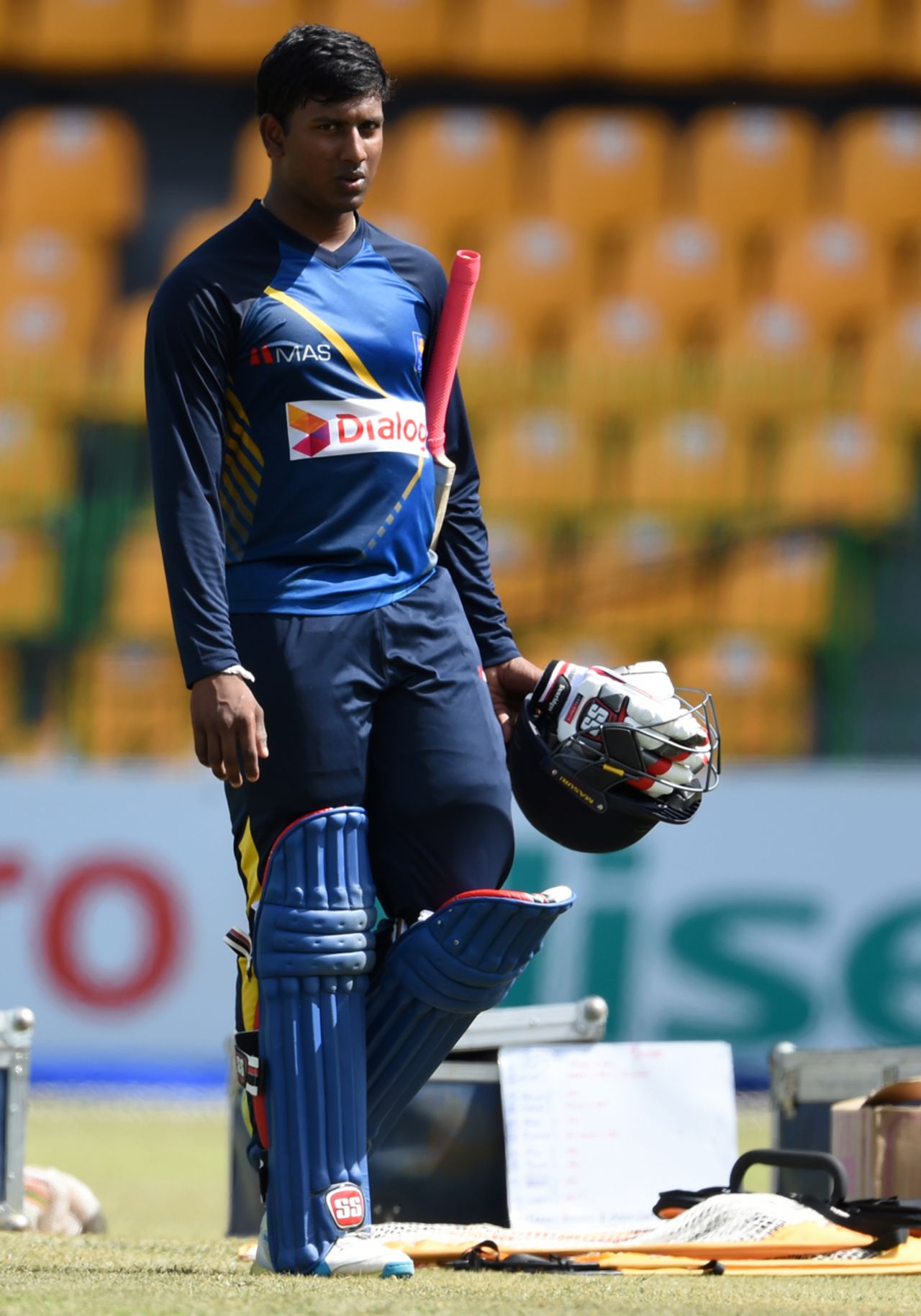 Avishka Fernando walks with his batting equipment during training, Colombo, August 20, 2016