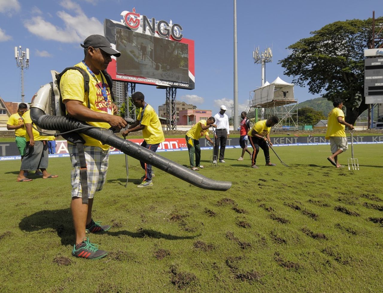 Ground staff opened up the outfield with a pitch fork and used a blower to aid the drying process, West Indies v India, 4th Test, Port of Spain, 3rd day, August 20, 2016