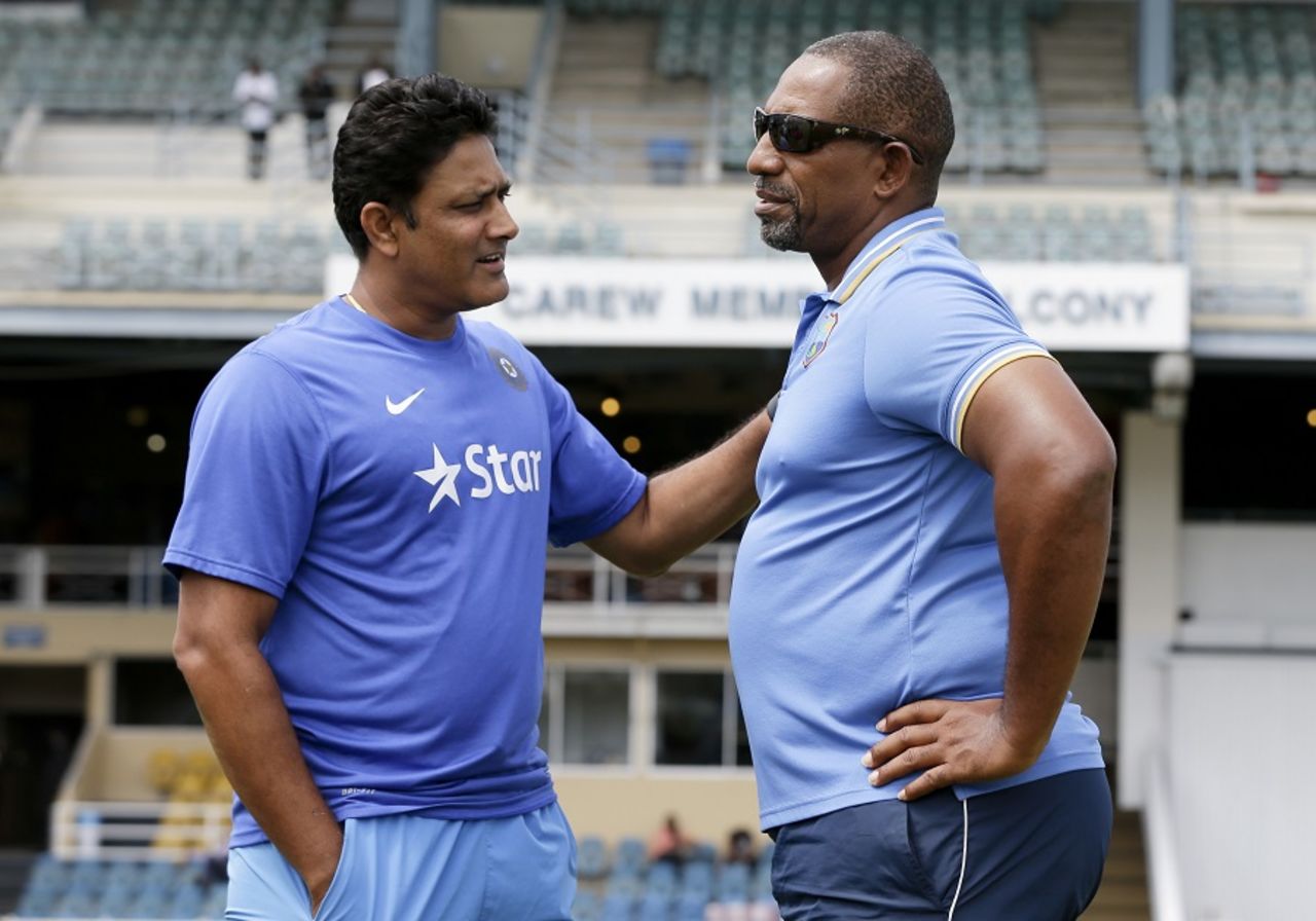 India coach Anil Kumble and West Indies coach Phil Simmons are engaged in conversation, West Indies v India, 4th Test, Port of Spain, 4th day, August 21, 2016