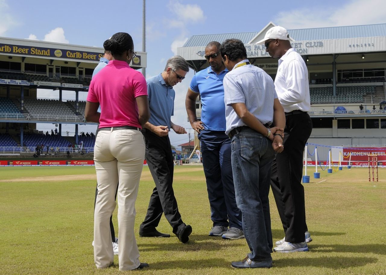 West Indies coach Phil Simmons, along with other match officials, inspects the outfield, West Indies v India, 4th Test, Port of Spain, 4th day, August 21, 2016