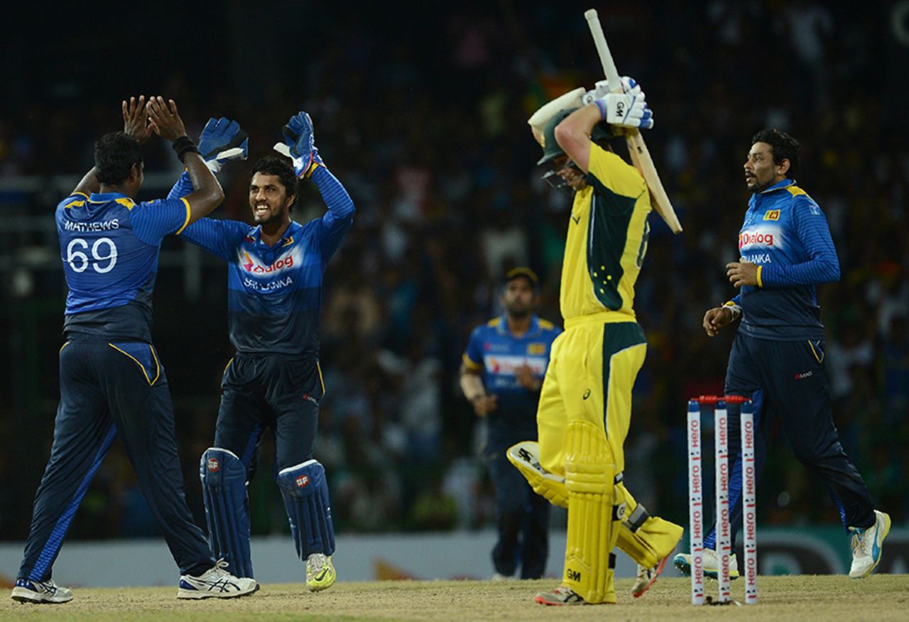 Angelo Mathews and Dinesh Chandimal celebrate Travis Head's dismissal, Sri Lanka v Australia, 2nd ODI, R Premadasa Stadium, August 24, 2016