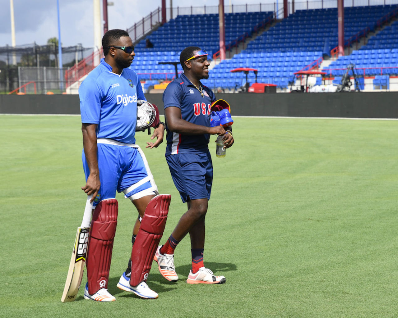 USA batsman Steven Taylor catches up with his Barbados Tridents captain Kieron Pollard in Florida, Lauderhill, August 25, 2016