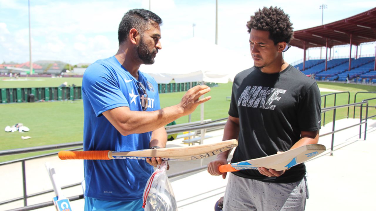 MS Dhoni teaches San Diego Padres outfielder Jon Jay about cricket bats, Lauderhill, August 26, 2016 