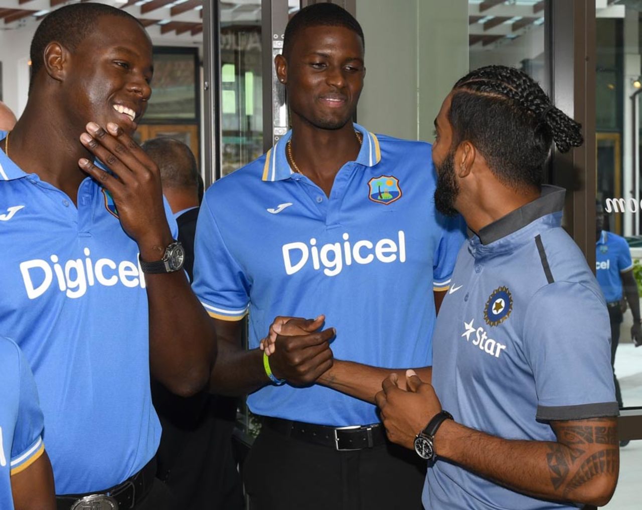KL Rahul has a cordial exchange with Jason Holder and Carlos Brathwaite, Fort Lauderdale, August 26, 2016