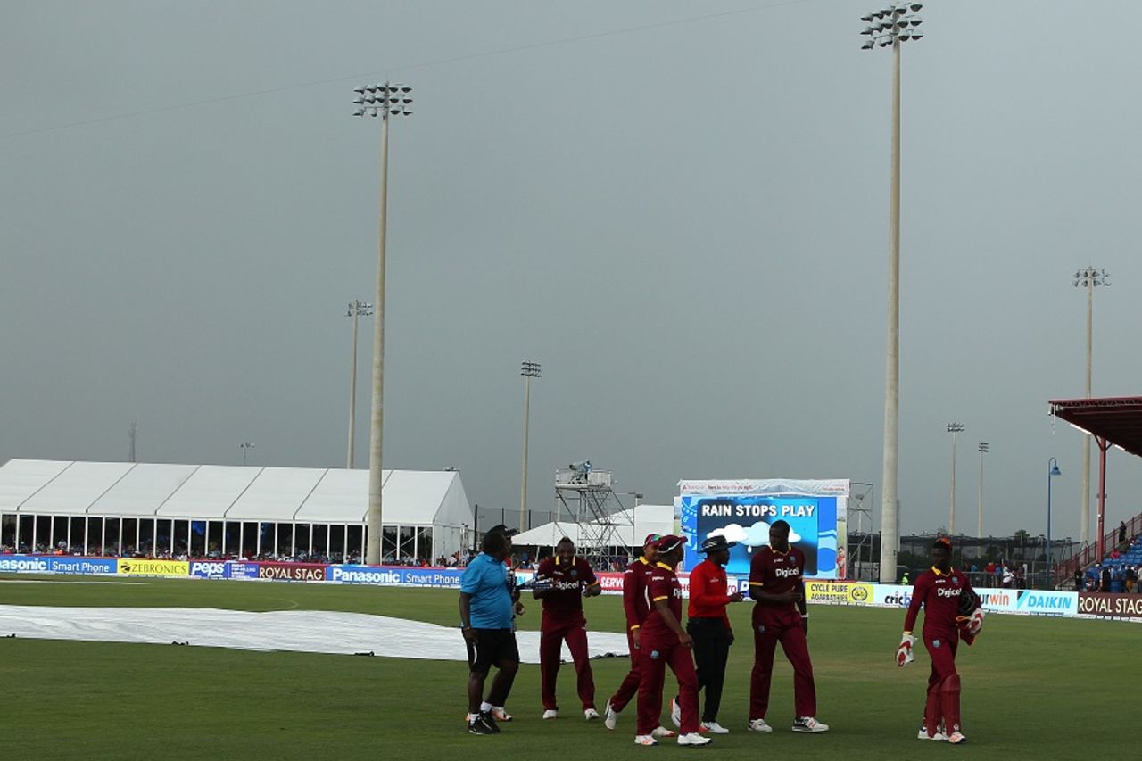 West Indies players walk off the field as dark clouds envelop the sky and the rain comes down, India v West Indies, 2nd T20I, Florida, August 28, 2016