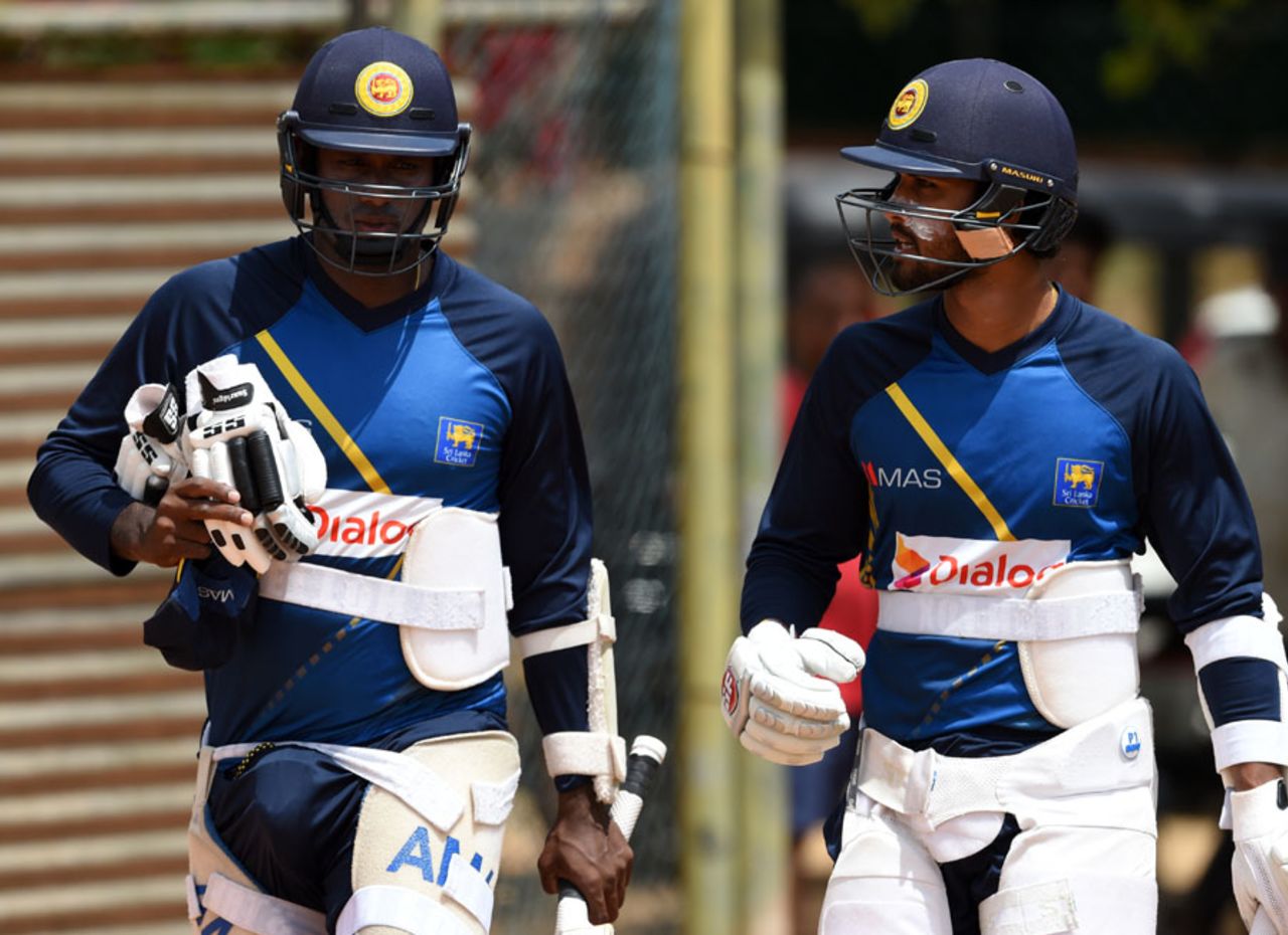 Angelo Mathews and Dinesh Chandimal have a chat during practice, Dambulla, August 30, 2016