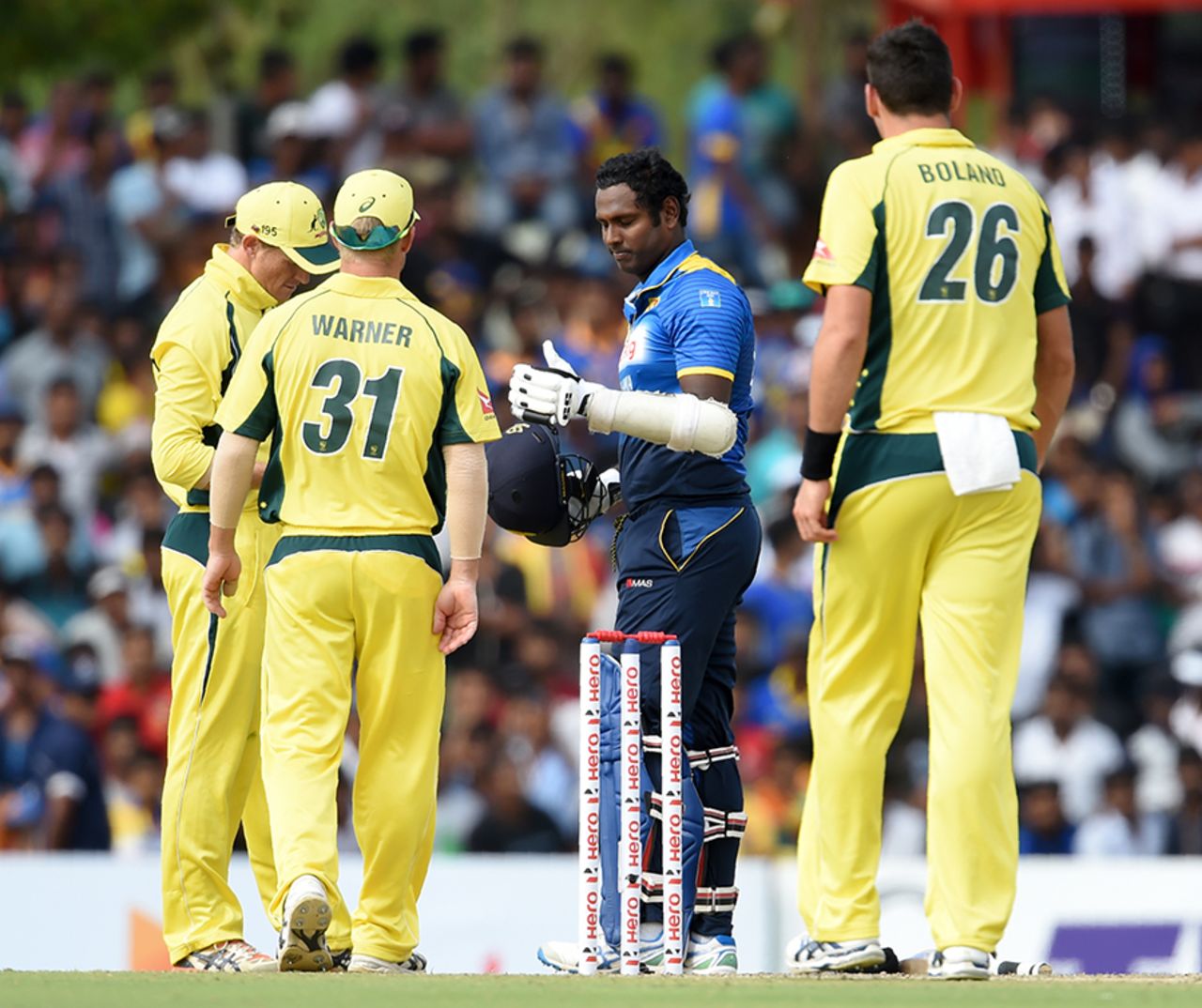 Australia's fielders check on Angelo Mathews after he took a blow to the helmet, Sri Lanka v Australia, 4th ODI, Dambulla, August 31, 2016