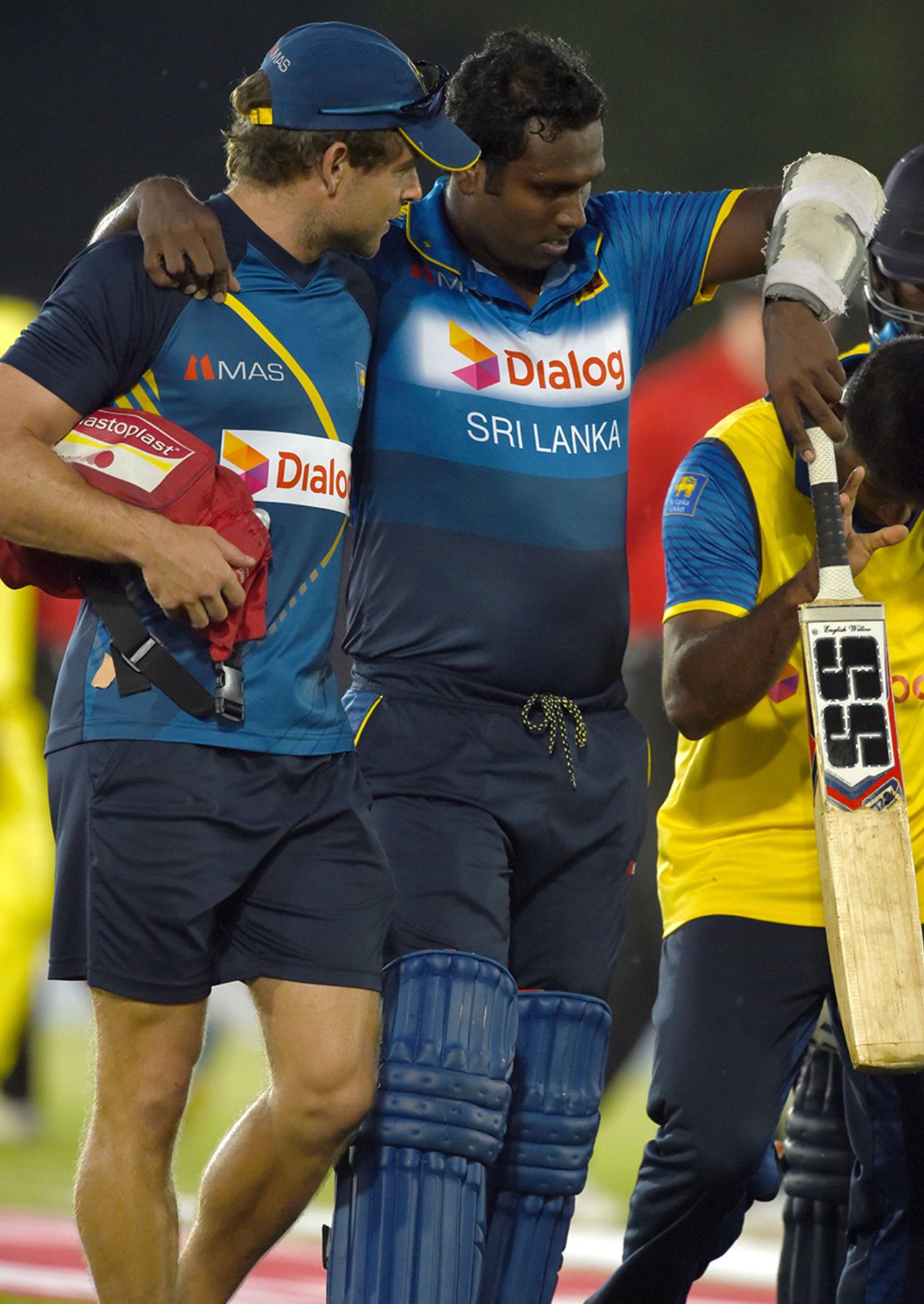An injured Angelo Mathews is helped off the field, Sri Lanka v Australia, 4th ODI, Dambulla, August 31, 2016