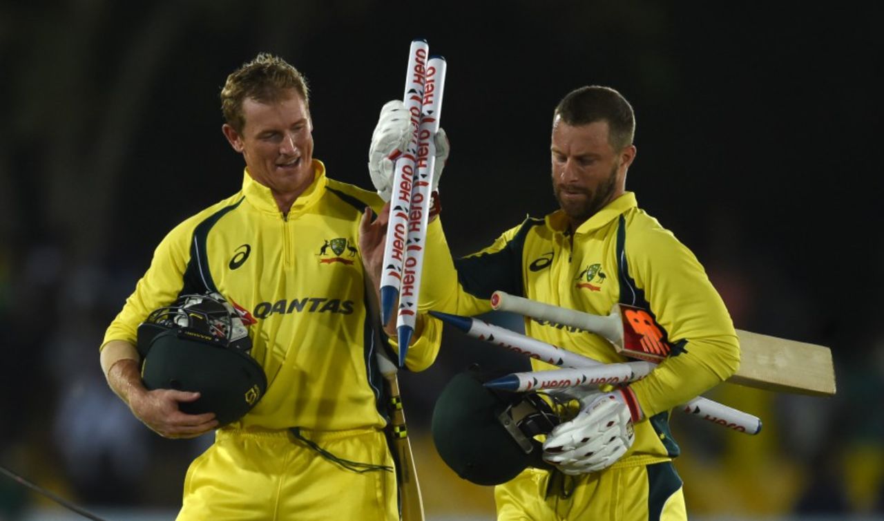 Matthew Wade and George Bailey collect souvenirs after Australia's win, Sri Lanka v Australia, 4th ODI, Dambulla, August 31, 2016