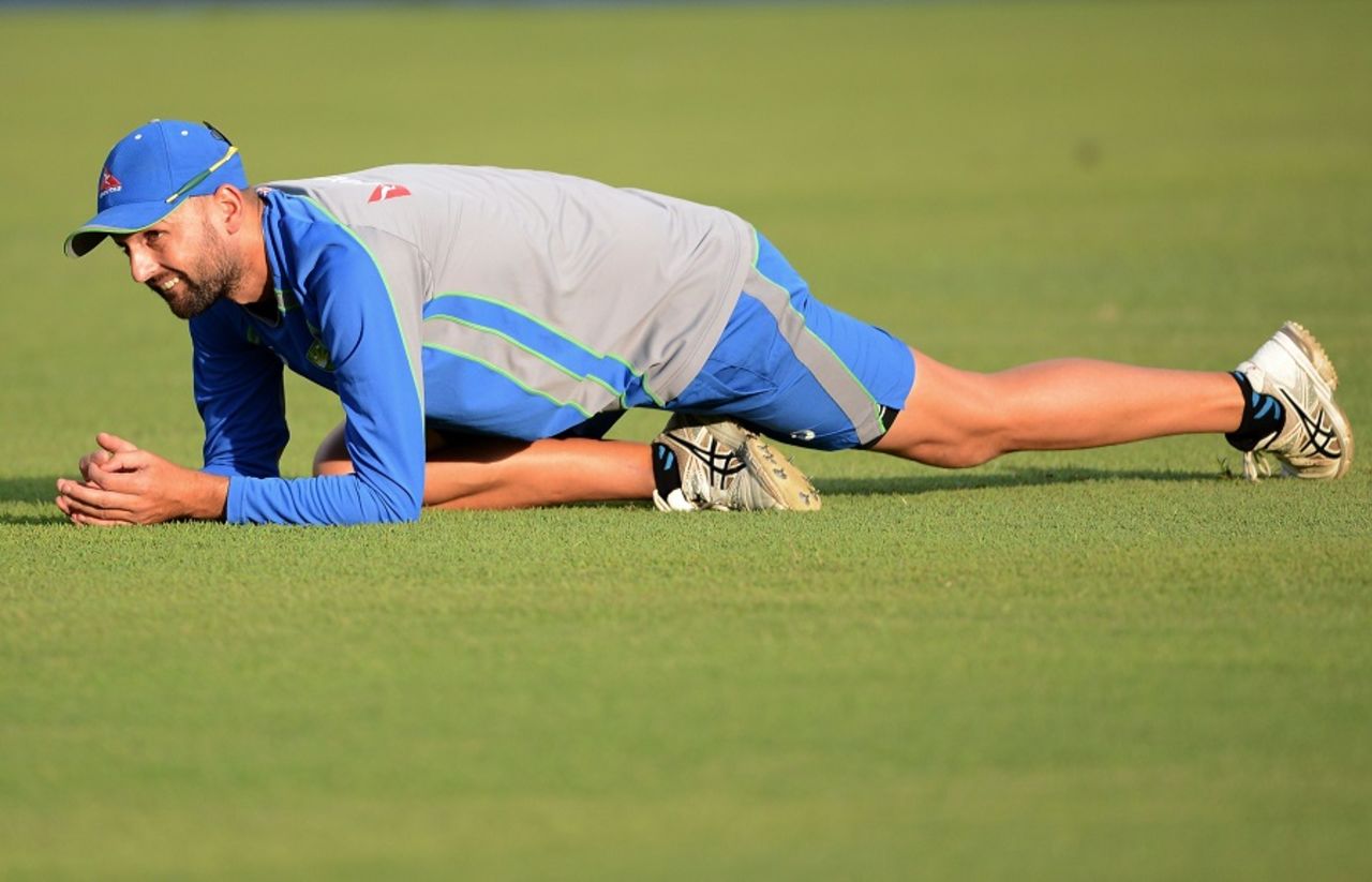 Nathan Lyon stretches during Australia's training session, Pallekele, September 3, 2016