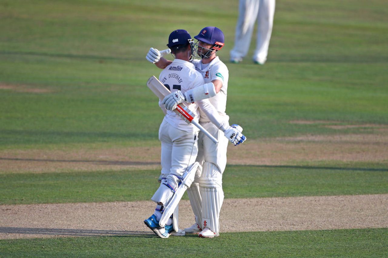 James Foster and Ryan ten Doeschate embrace as Essex achieve promotion from Division Two of the Championship, Essex v Glamorgan, Specsavers Championship Division Two, Chelmsford, September 