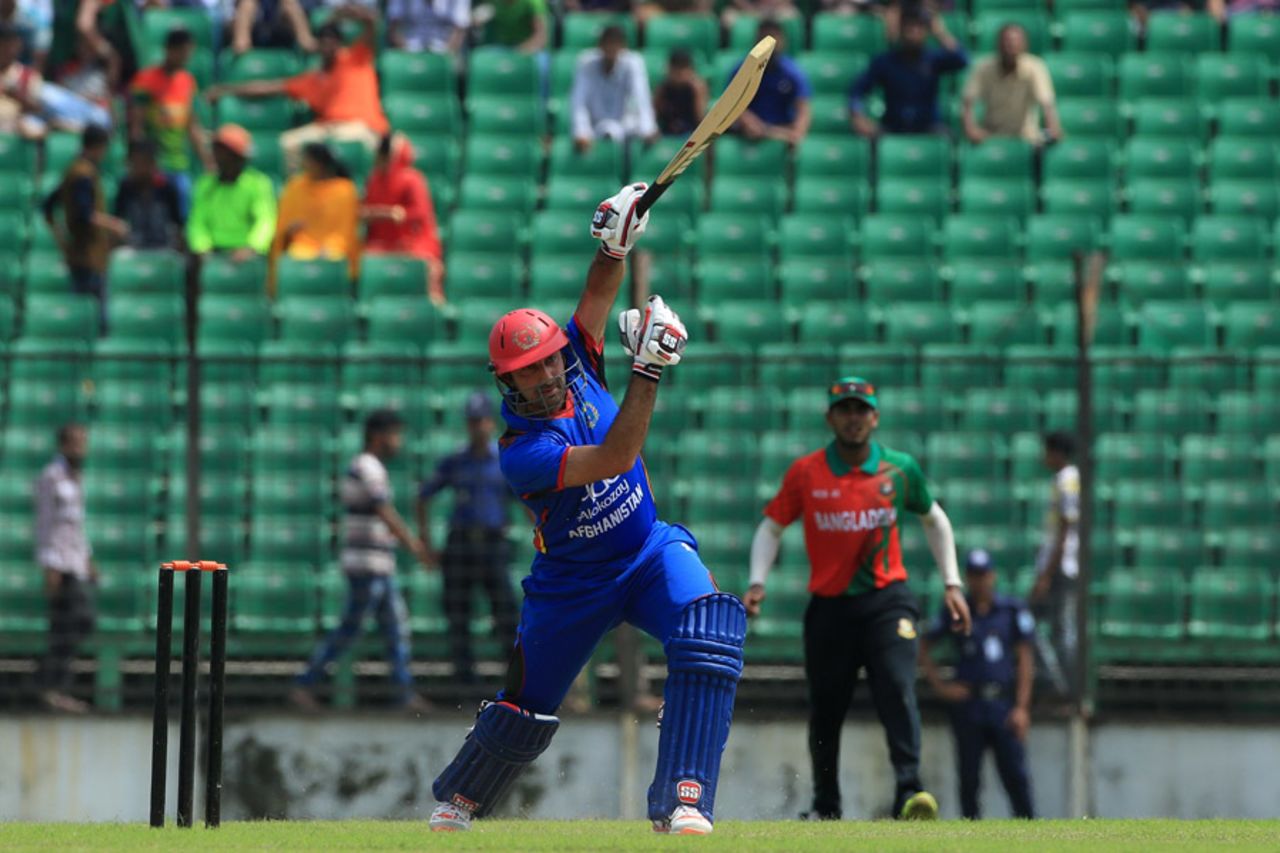 Asghar Stanikzai takes his bottom hand off the bat while driving down the ground, BCB XI v Afghanistan, Fatullah, September 23, 2016
