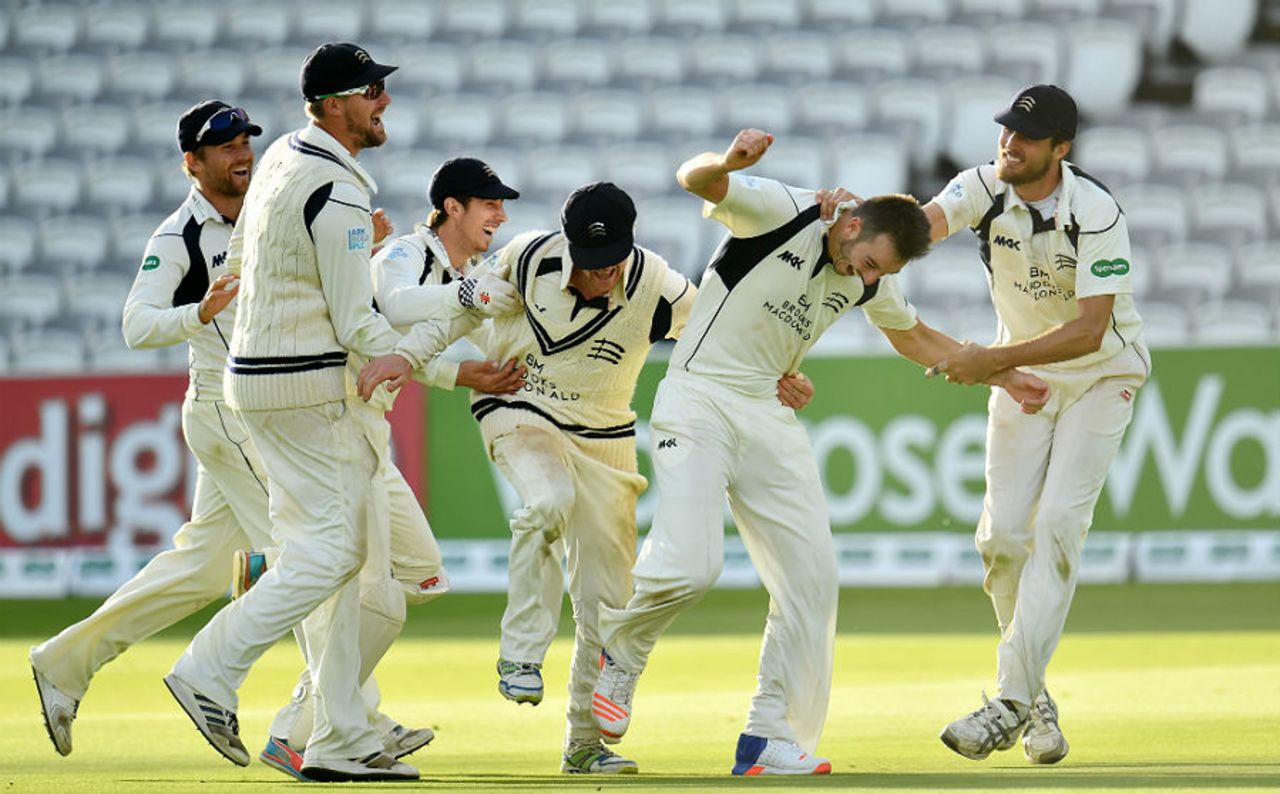 Middlesex's players mob Toby Roland-Jones after sealing victory in the County Championship, Middlesex v Yorkshire, County Championship, Division One, Lord's, September 23, 2016