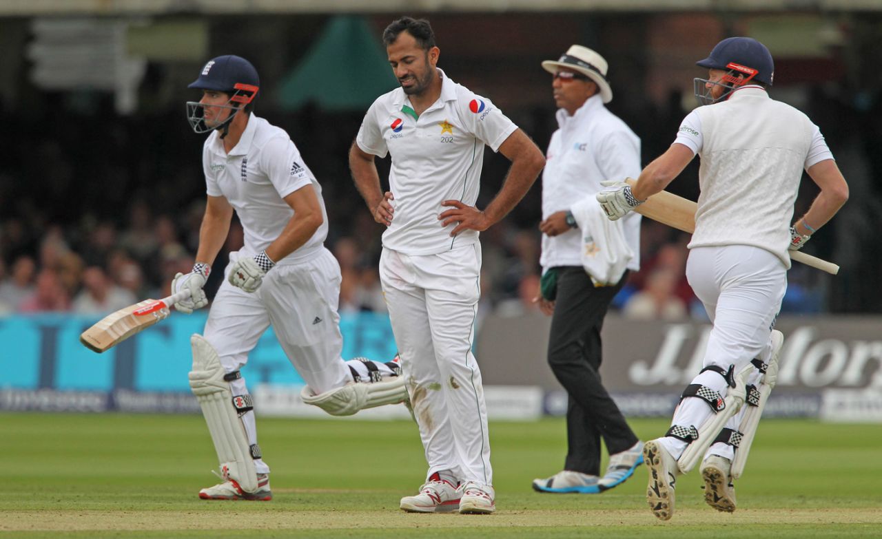 Wahab Riaz looks disappointed as Alastair Cook and Jonny Bairstow take a run, England v Pakistan, 1st Investec Test, Lord's, 2nd day, July 15, 2016