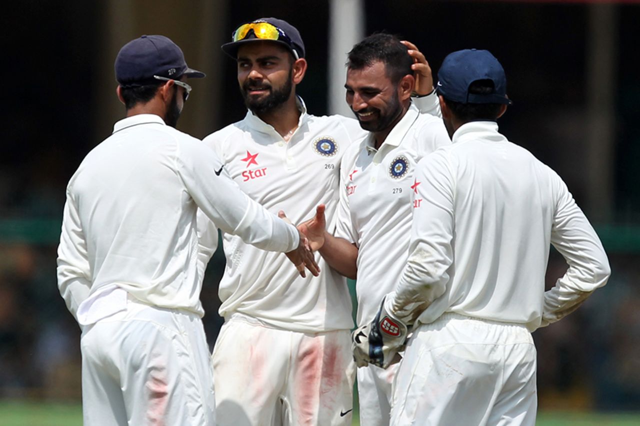 Team-mates congratulate Mohammed Shami after his wicket of Mark Craig, India v New Zealand, 1st Test, Kanpur, 5th day, September 26, 2016