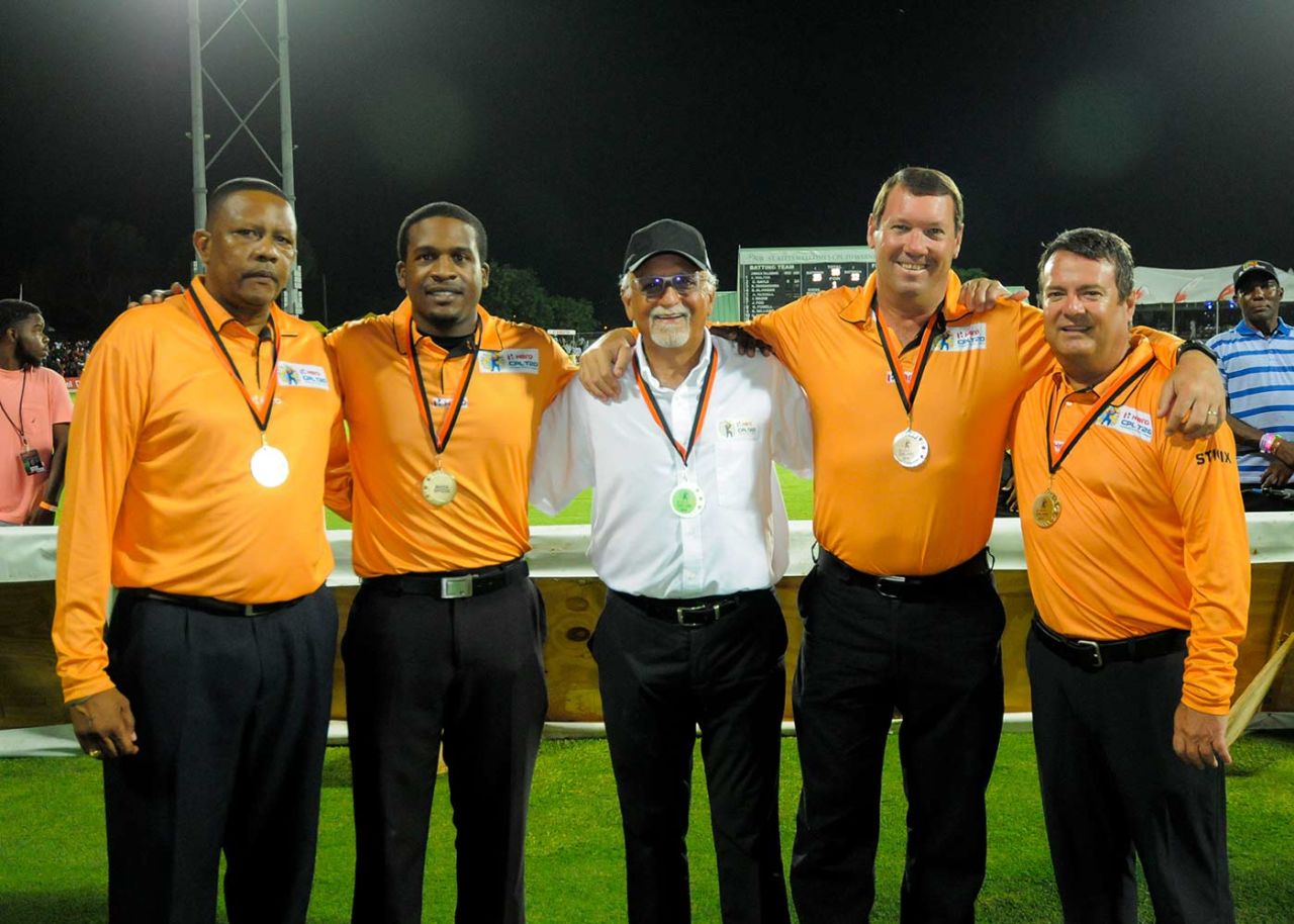 Umpires in the CPL (from left: Wycliffe Mitchum, Leslie Reifer, match referee Dev Govindjee, Johan Cloete and John Ward) line up for a photograph at the end of the match, Guyana Amazon Warriors v Jamaica Tallawahs, final, Caribbean Premier League, Basseterre, August 7, 2016