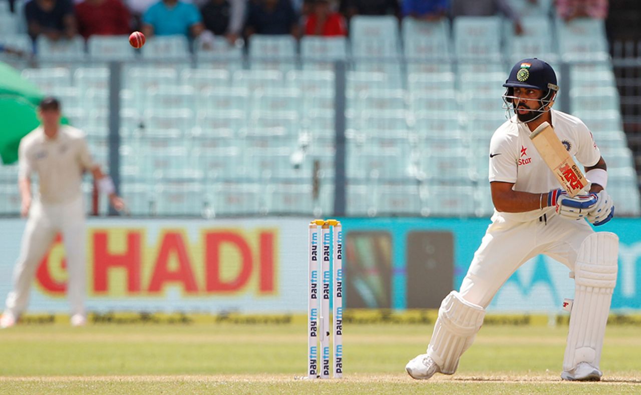 Virat Kohli looks on after tapping the ball on the off side, India v New Zealand, 2nd Test, Kolkata, 1st day, September 30, 2016