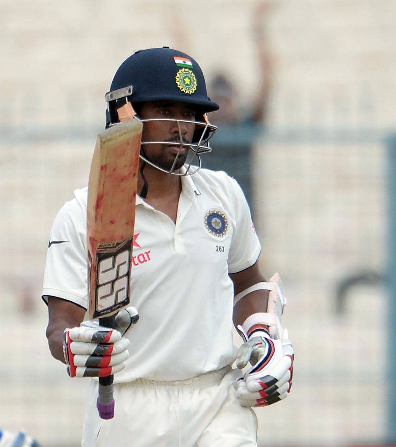 Wriddhiman Saha raises his bat after scoring his second fifty of the match, India v New Zealand, 2nd Test, Kolkata, 4th day, October 3, 2016