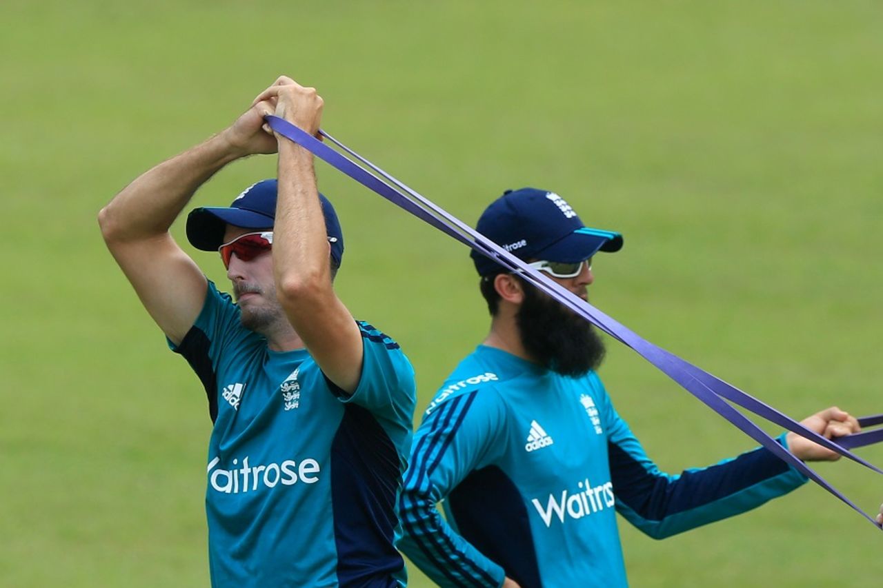 Steven Finn and Moeen Ali engage in a stretching drill, Mirpur, October 3, 2016