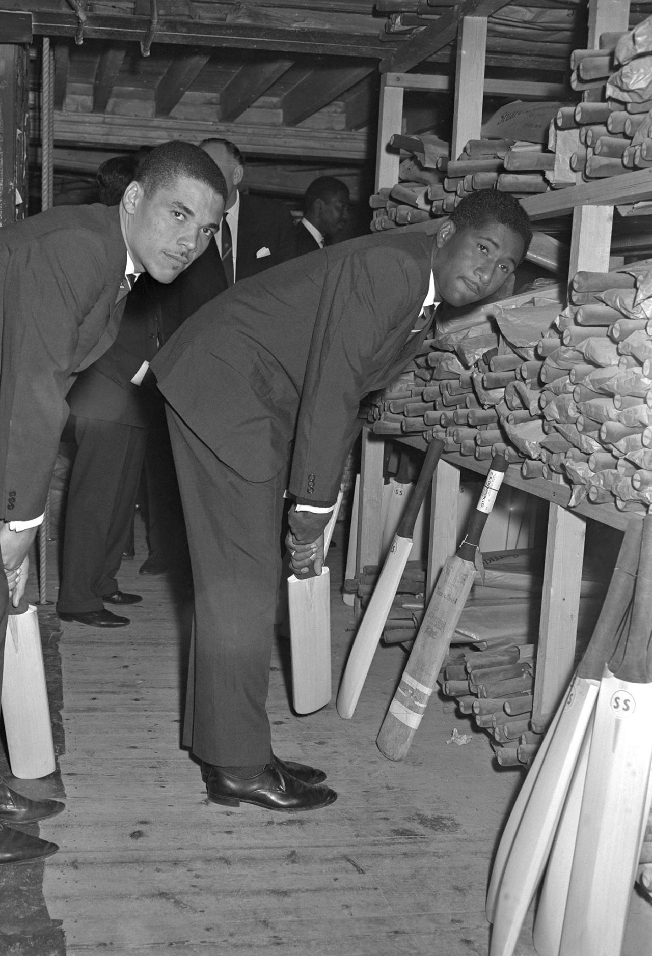 Peter Lashley (left) and Rawle Brancker select cricket bats at Stuart Surridge, at the start of the West Indies tour of England, April 19, 1966