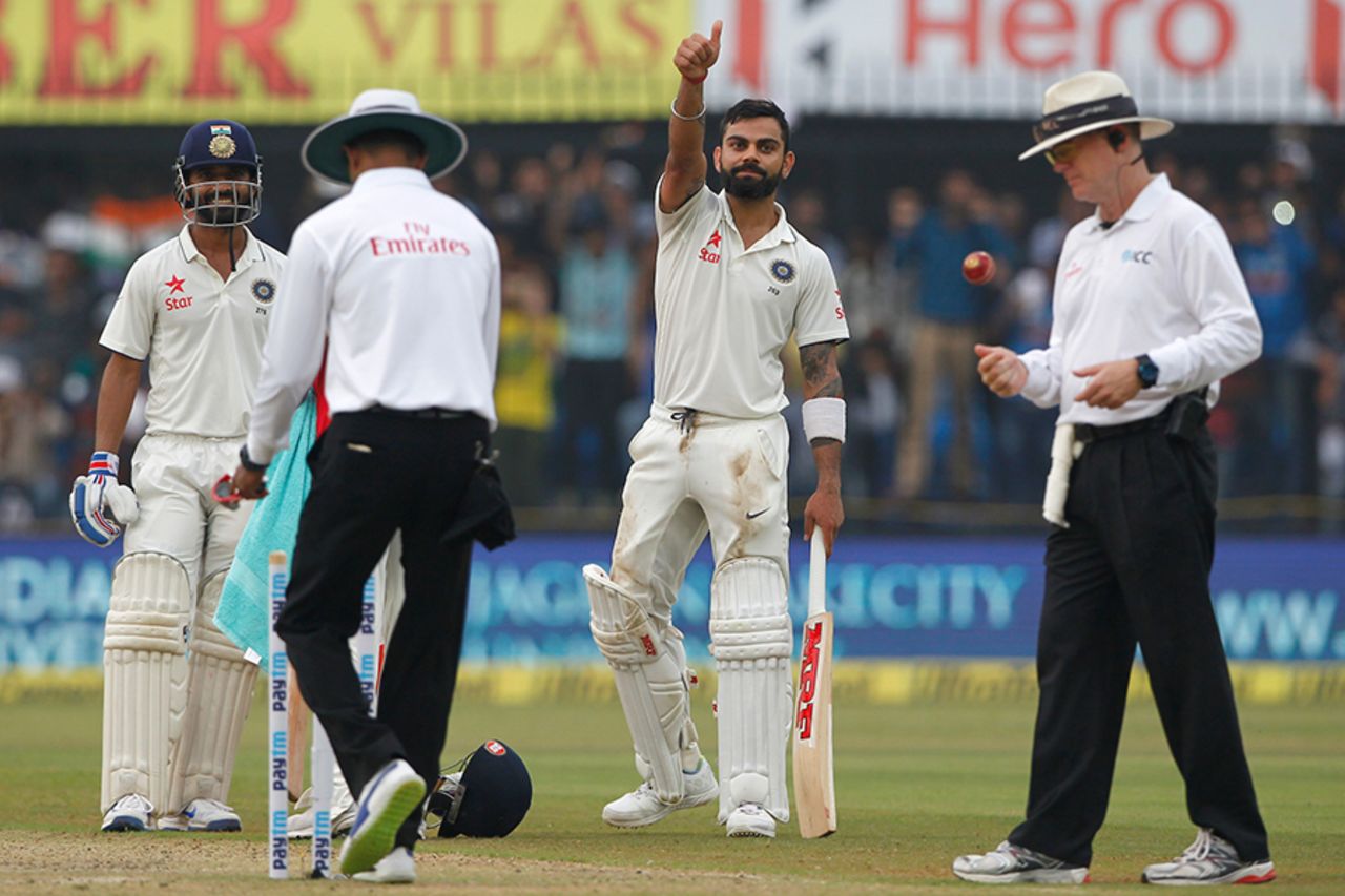 Virat Kohli gestures to the dressing room after scoring his century, India v New Zealand, 3rd Test, Indore, 1st day, October 8, 2016