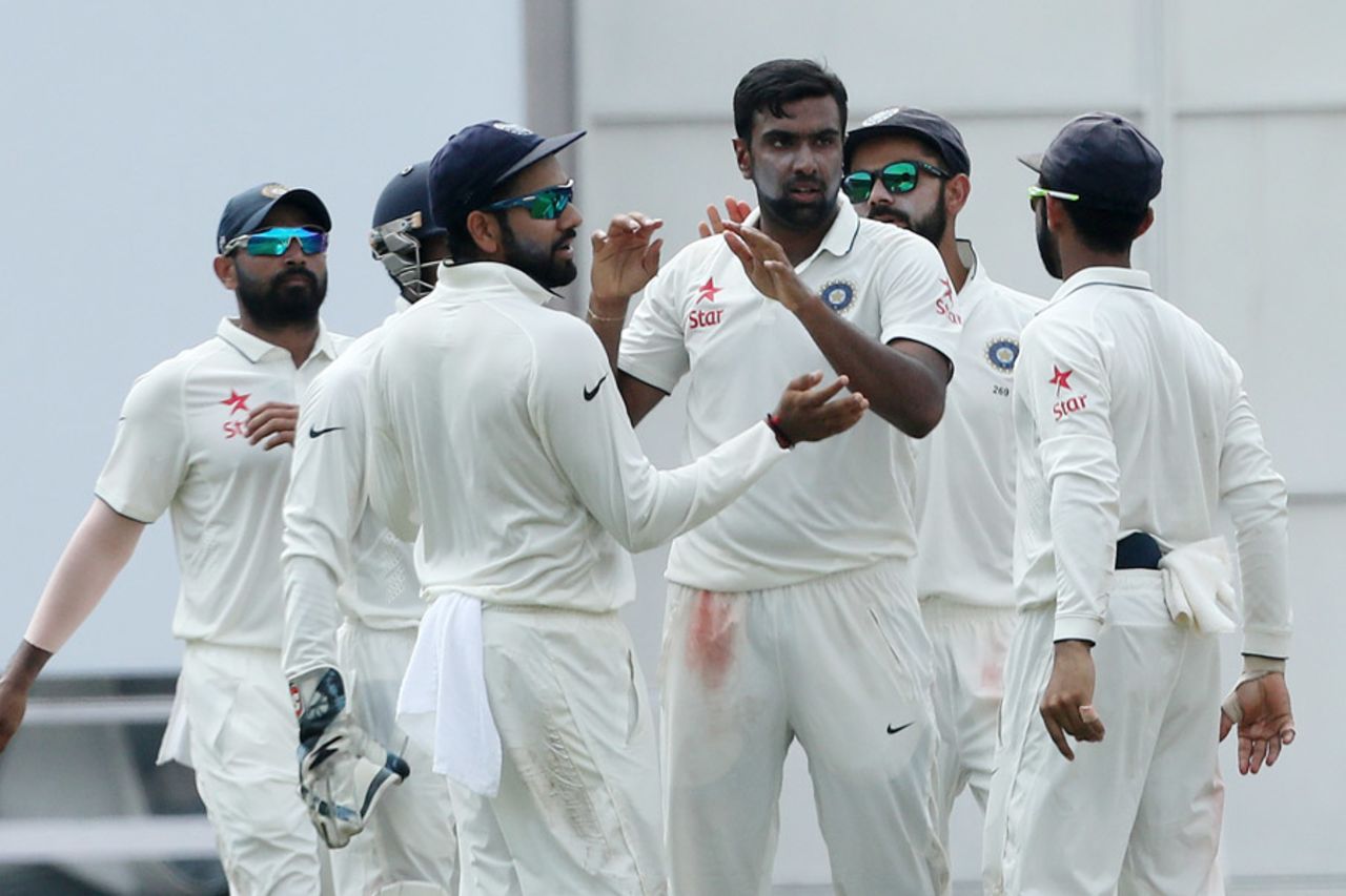 R Ashwin celebrates the wicket of Tom Latham with his team-mates, India v New Zealand, 3rd Test, Indore, 3rd day, October 10, 2016