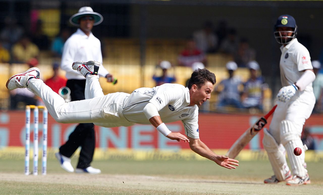 Trent Boult makes an acrobatic save off his bowling, India v New Zealand, 3rd Test, Indore, 4th day, October 11, 2016