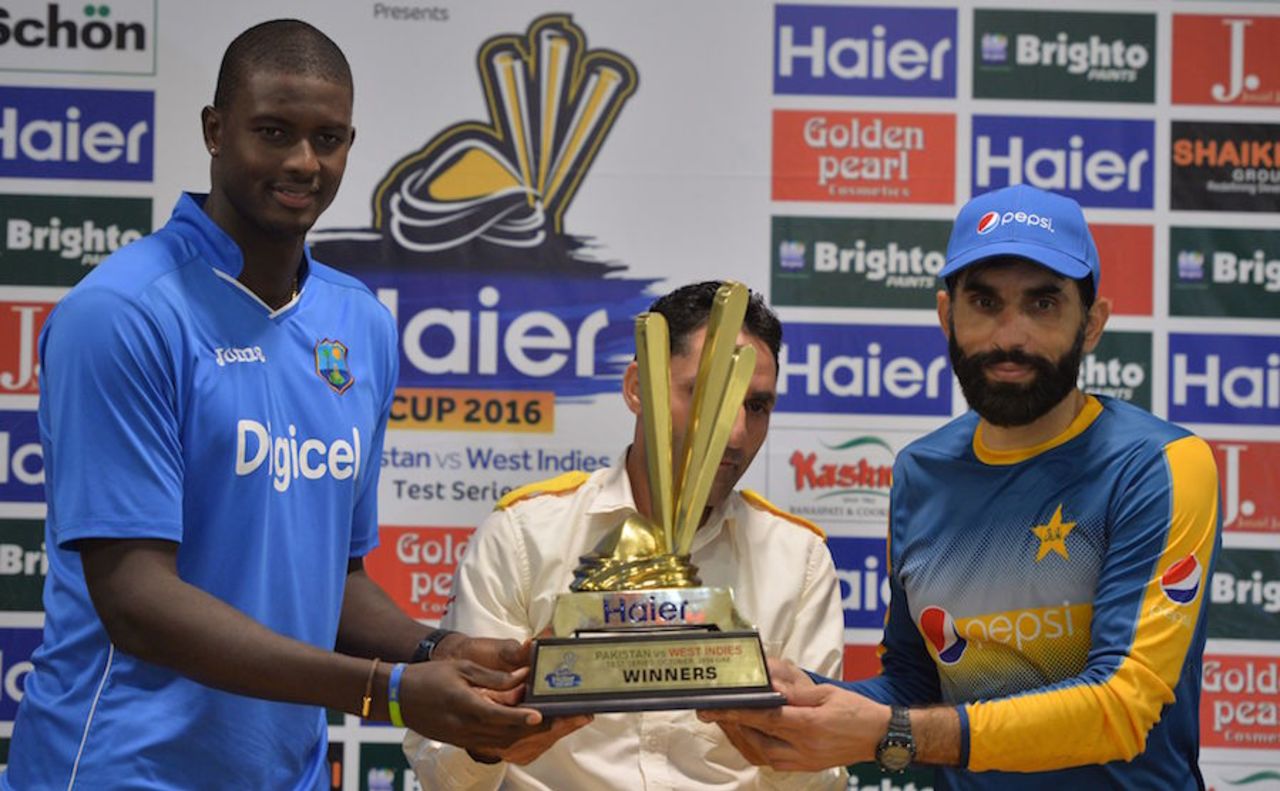 Jason Holder and Misbah-ul-Haq pose with the series trophy, Dubai, October 12, 2016